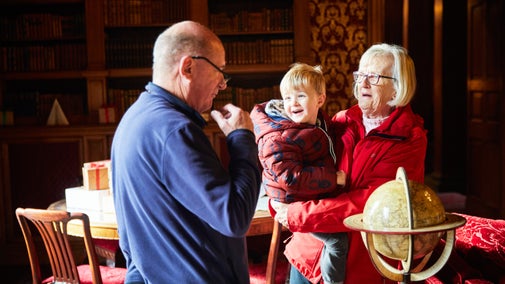 Visitors in the Library at Lyme, Cheshire